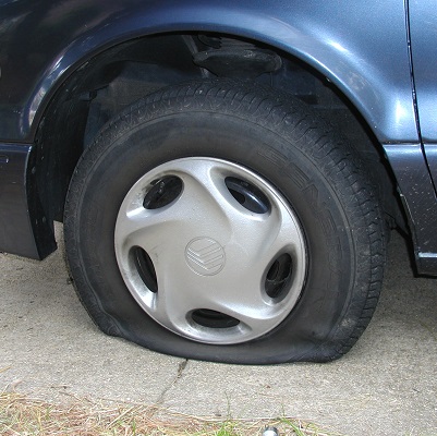 CHANGING A FLAT TIRE